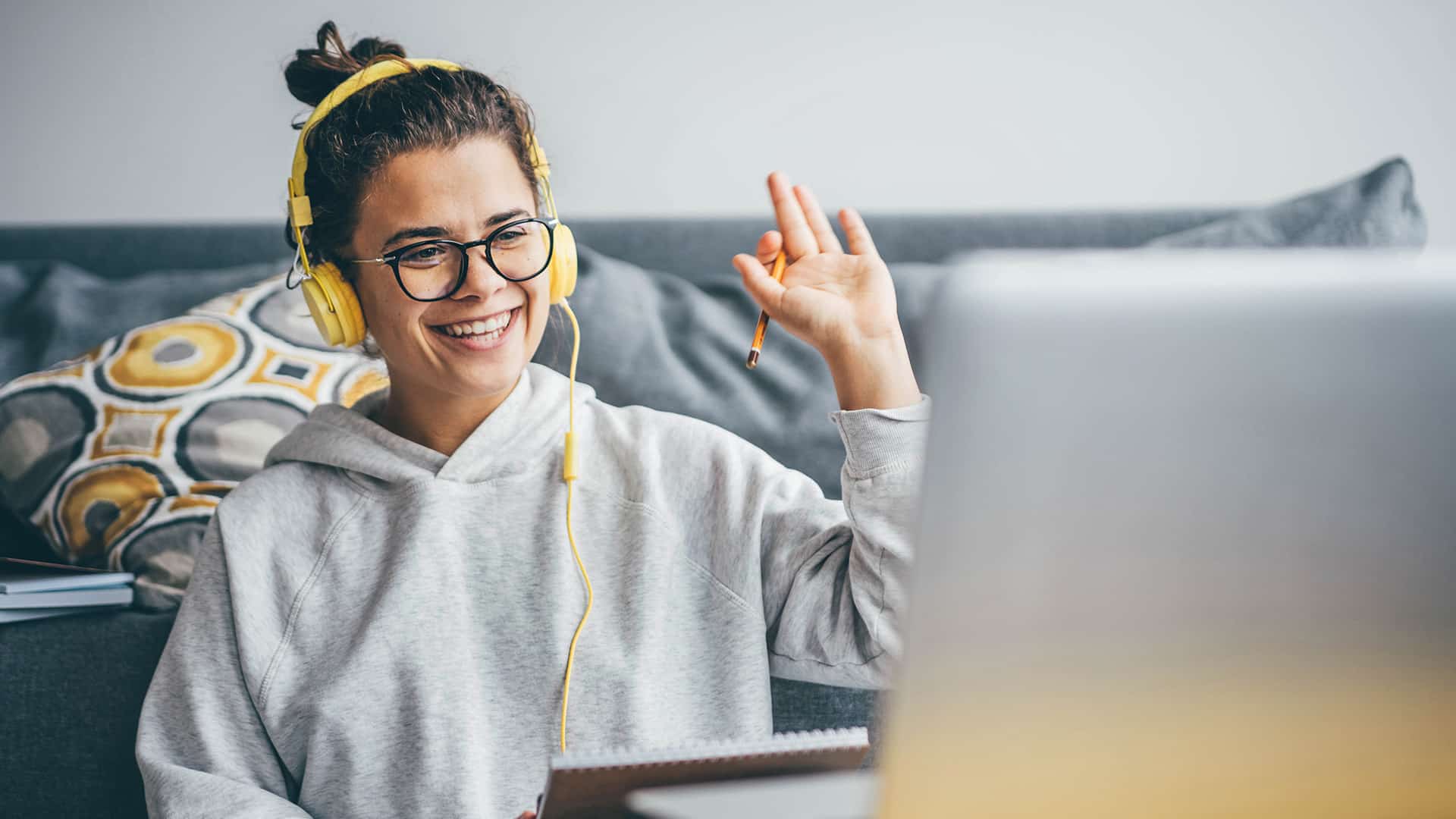 online student waves on video call