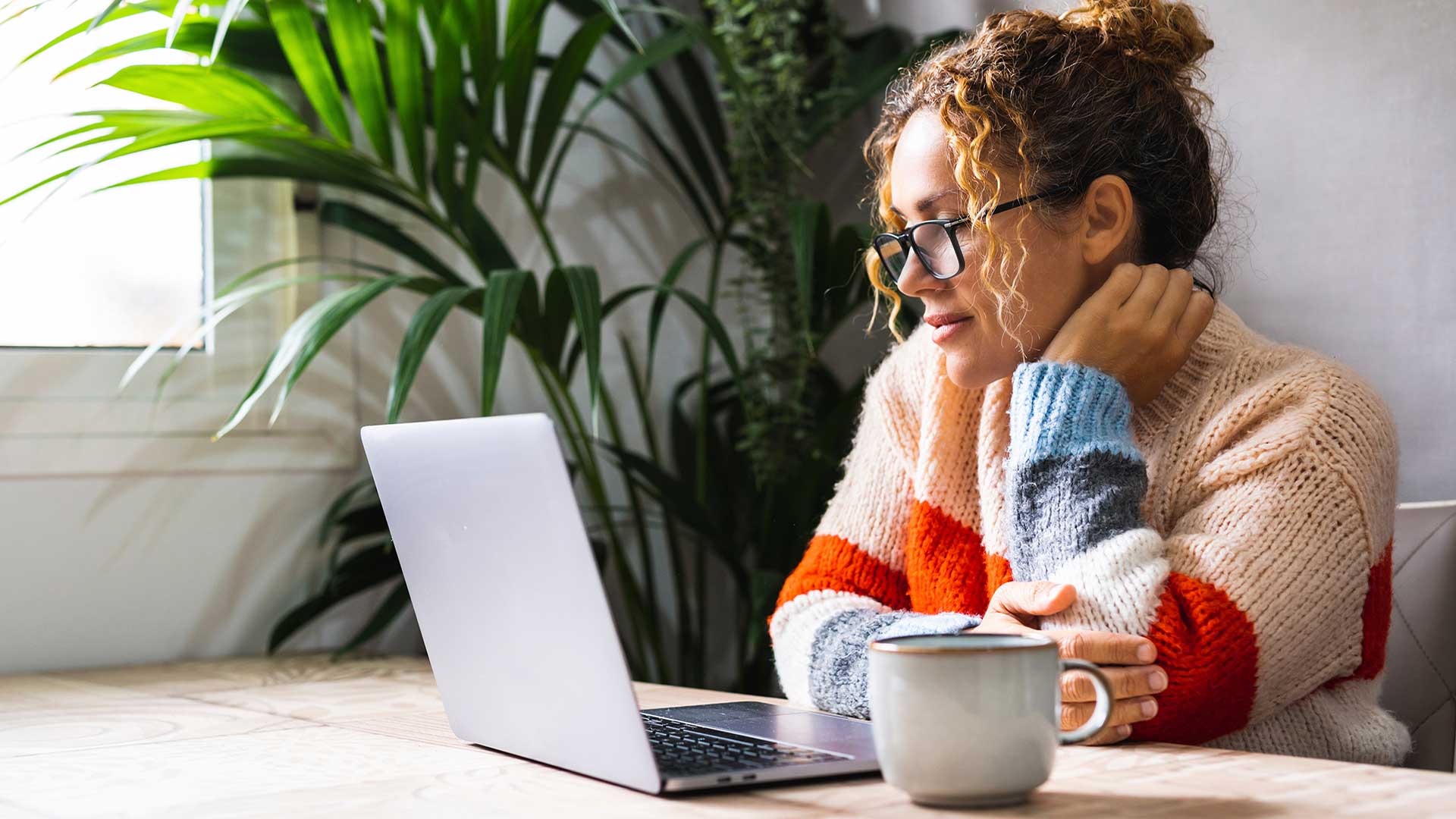 woman reading her doctoral dissertation online